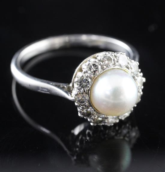 A white gold, cultured pearl and diamond circular cluster ring, size O.